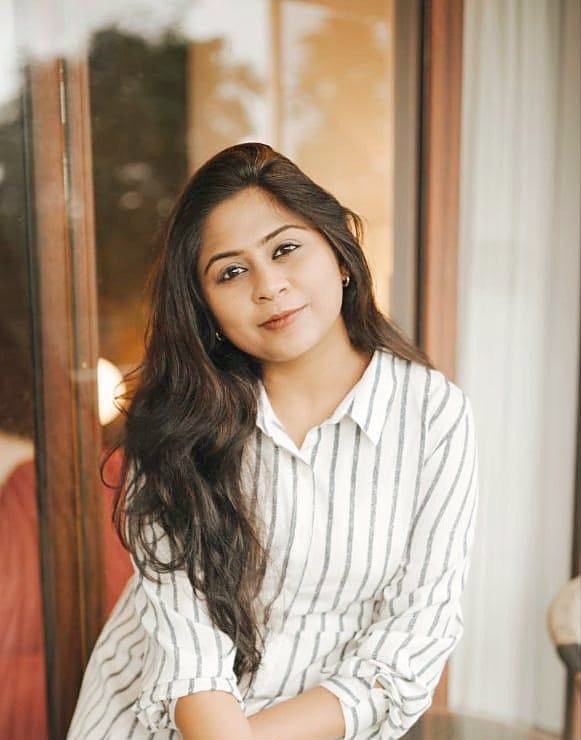 Dr. Aiswaryia Mohan in a striped shirt