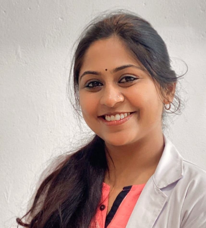 Dr. Aiswaryia Mohan in a white coat